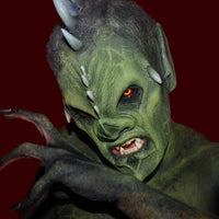professional makeup on horned creature mask