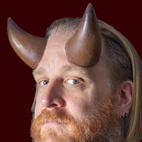 Large costume horns with SPFX makeup