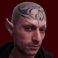 man wearing foam latex prosthetic ears